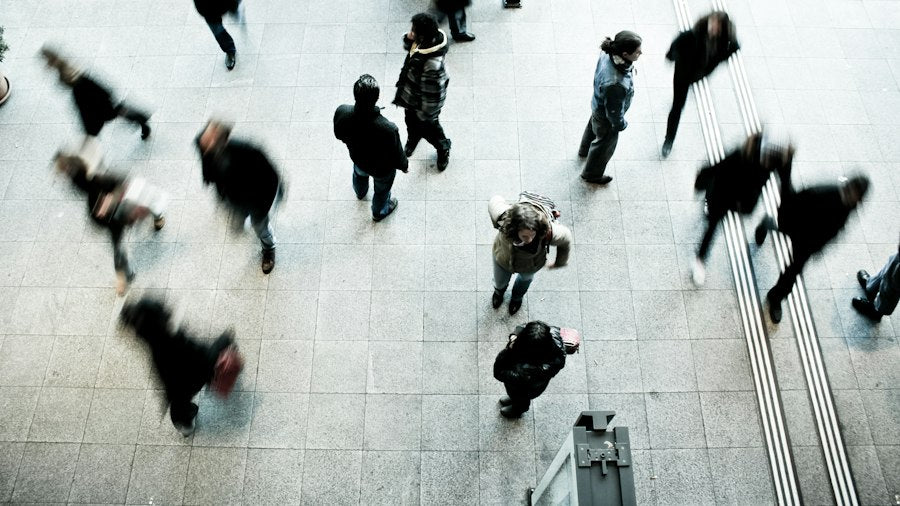 Overhead view of people moving through a plaza